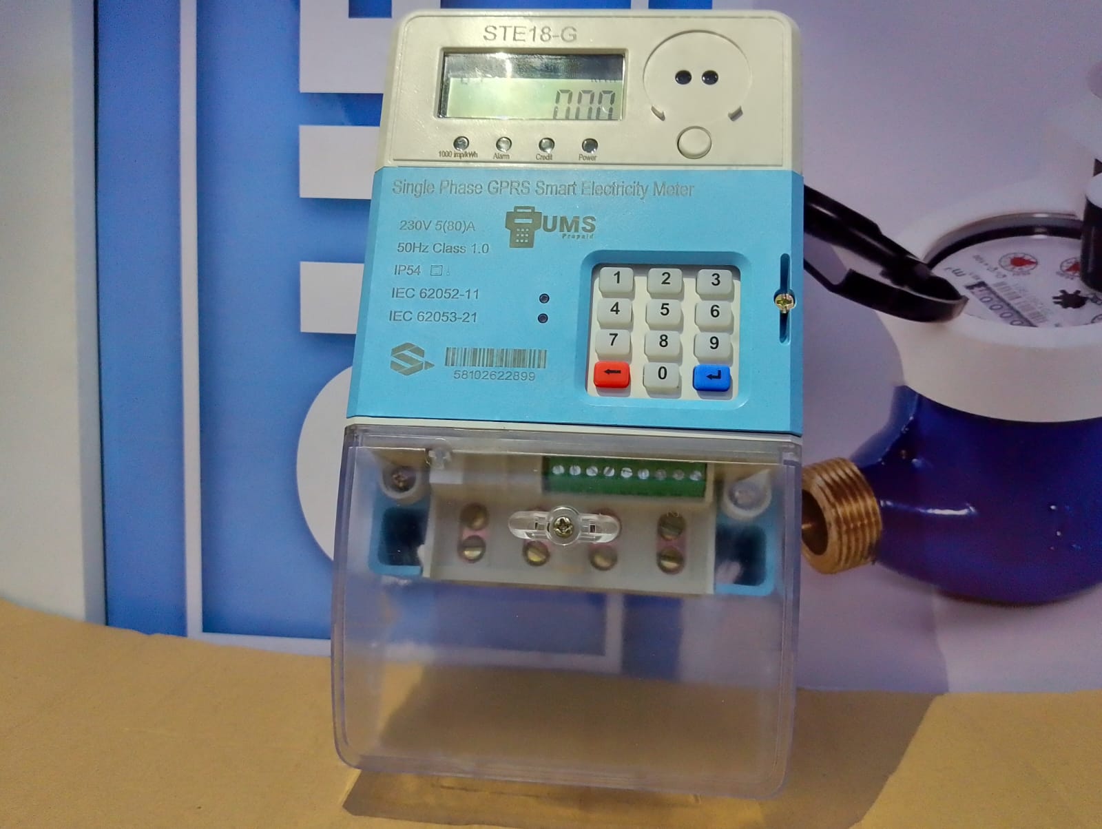 A modern smart meter displaying energy consumption.